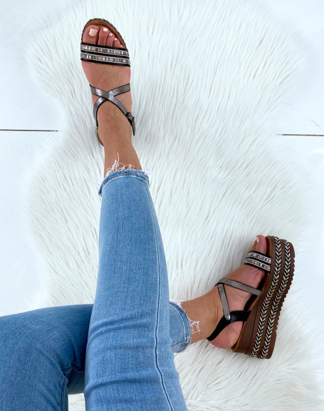 Black sandals with wedge heels and multiple fancy straps
