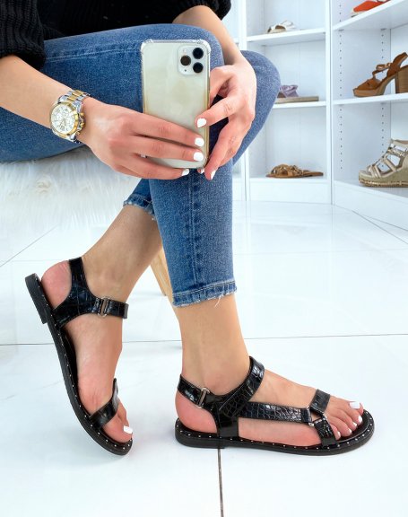 Black slippers with asymmetrical croc-effect straps