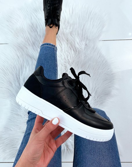 Black sneaker with white sole