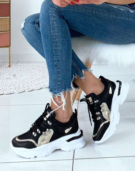 Black sneakers with gold insert and band on heel