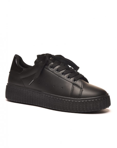 Black sneakers with thick sole and black detail