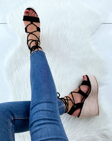 Black suede wedges with straps and crisscrossed laces
