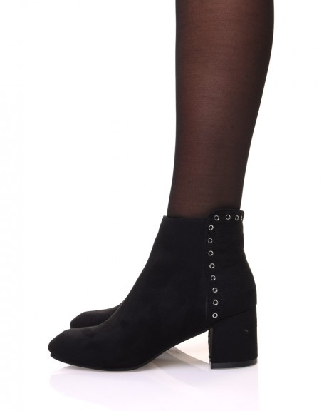 Black suedette ankle boots adorned with eyelets