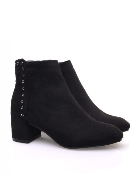 Black suedette ankle boots adorned with eyelets