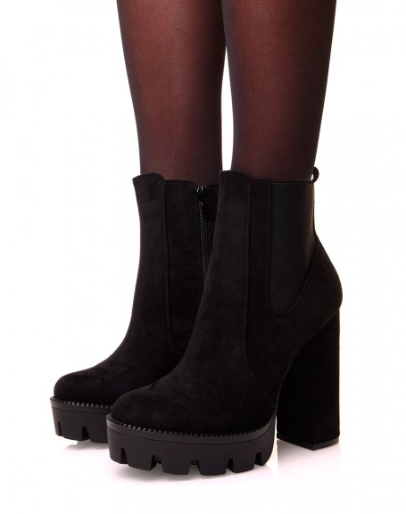 Black suedette ankle boots with heels and notched platforms