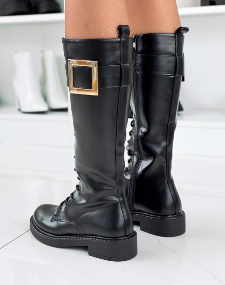 Black tall boots with big gold buckle