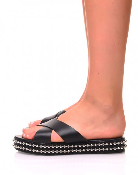 Black wedge sandals with metallic detail on the sole