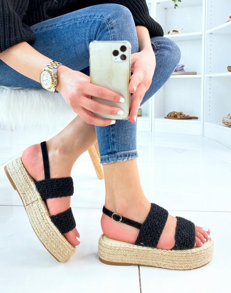Black wedge sandals with textured straps