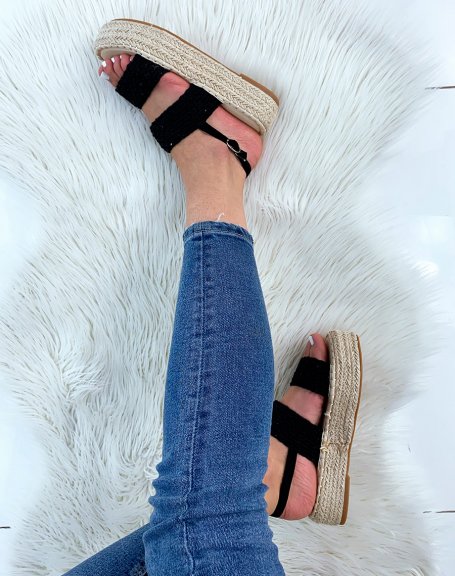 Black wedge sandals with textured straps