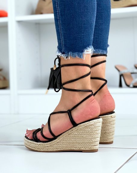 Black wedges with thin straps and criss-cross laces