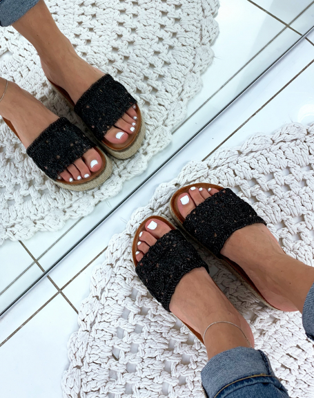 Black wicker mules with braided patterns and platform