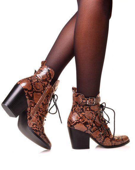 Brown cowboy boots with python-effect laces