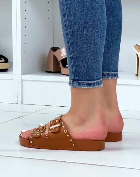 Brown flat mules with adjustable straps and gold studs