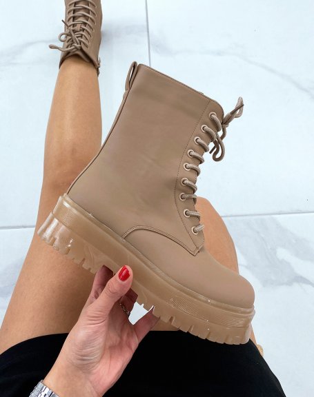 Brown high-top boots with laces and translucent sole