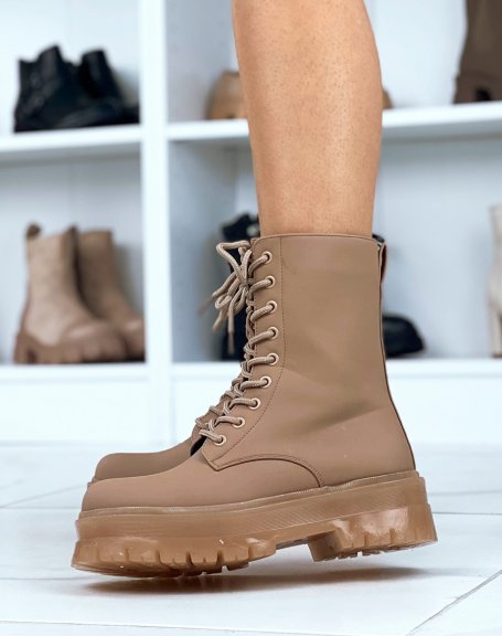 Brown high-top boots with laces and translucent sole