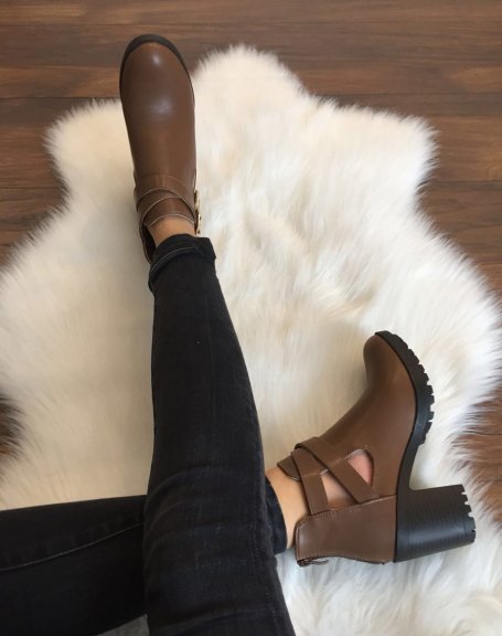Brown notched ankle boots with crossed buckles