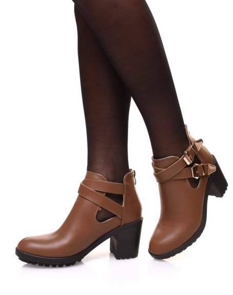 Brown notched ankle boots with crossed buckles
