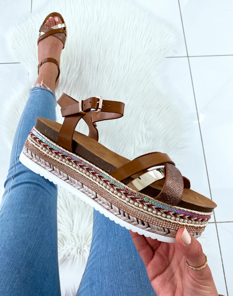 Brown sandals with fancy wedge soles and multiple straps