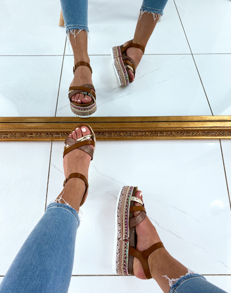 Brown sandals with fancy wedge soles and multiple straps