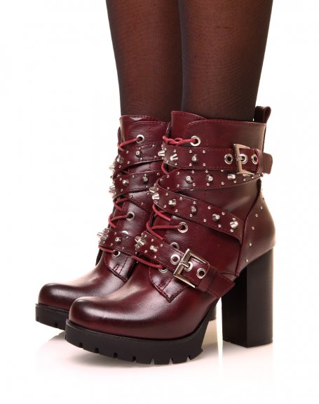 Burgundy ankle boots with studded straps at heels
