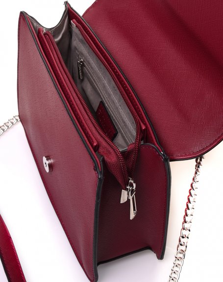 Burgundy textured handbag with double flaps and silver buckle