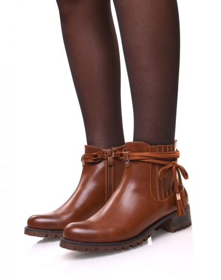 Camel Chelsea boots with straps and pompoms