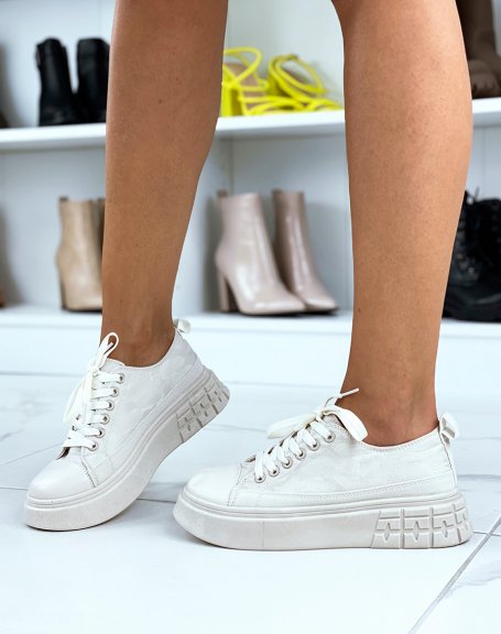 Canvas sneakers with beige patterns and beige sole