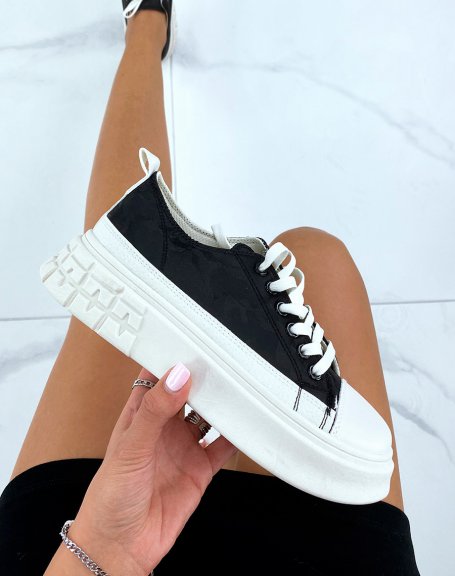 Canvas sneakers with black patterns and beige sole
