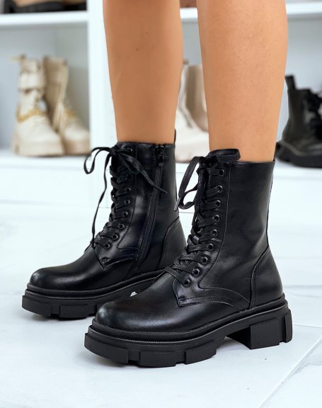 Extra high black ankle boots with laces and notched sole
