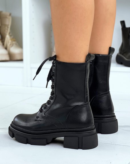 Extra high black ankle boots with laces and notched sole