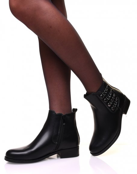 Flat ankle boots with metallic chains on the side