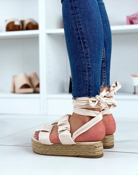 Flat beige wedge sandals with pleated straps