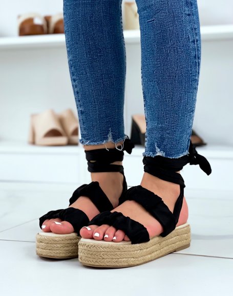 Flat black wedge sandals with pleated straps