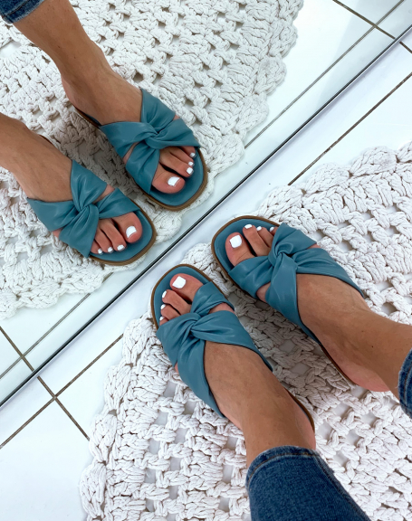 Flat blue sandals with crisscrossed straps