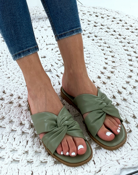 Flat green sandals with crisscross straps