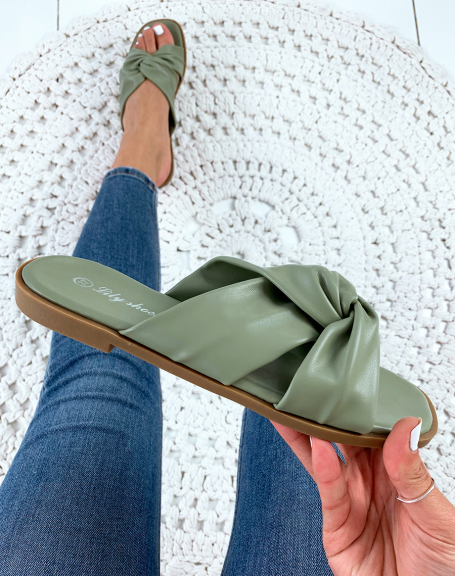 Flat green sandals with crisscross straps