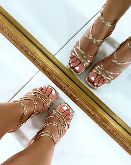 Gold heeled sandals with multiple straps