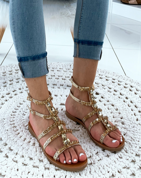 Gold high-top sandals with fancy jewels