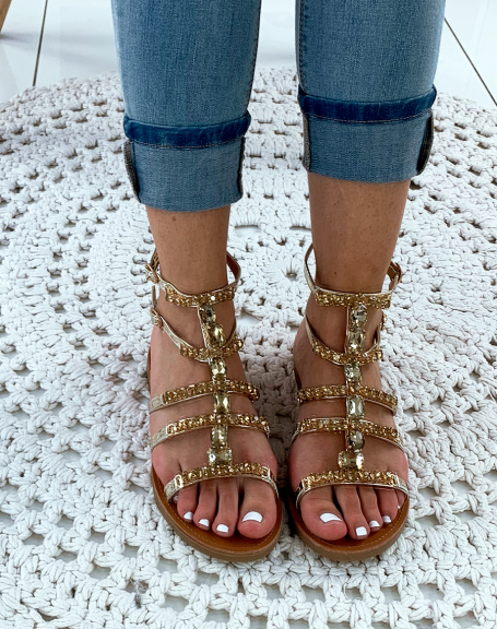 Gold high-top sandals with fancy jewels
