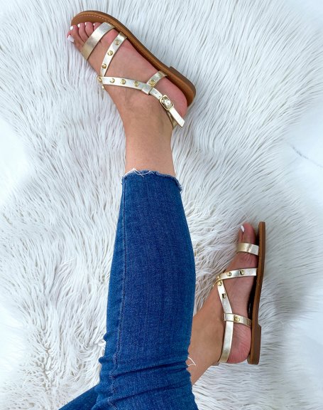 Gold sandals with multiple straps and studded details