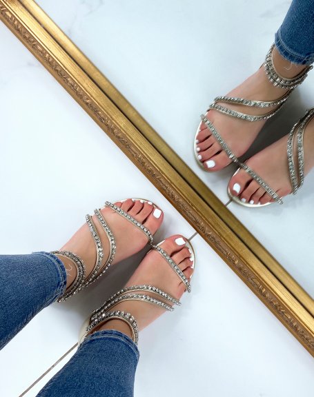 Gold sandals with rhinestone straps and zip closure