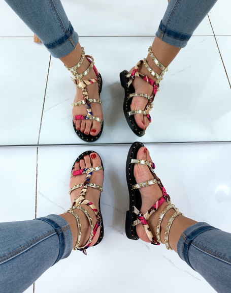 Gold strappy sandals adorned with studs and scarf details