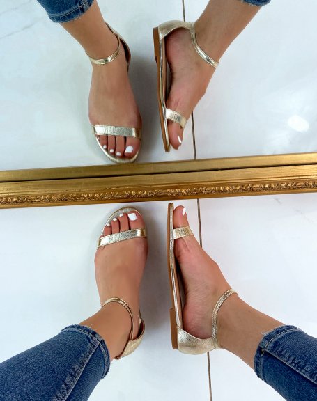 Golden flat sandals with thin straps