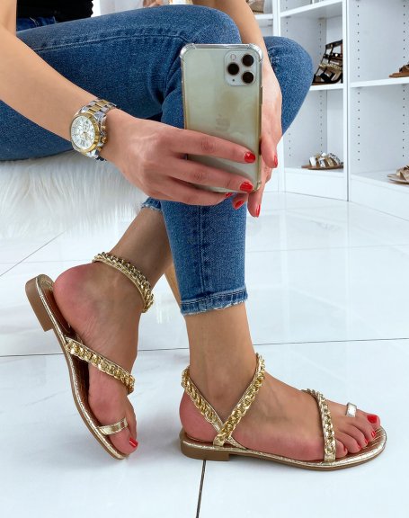 Golden sandals adorned with chains