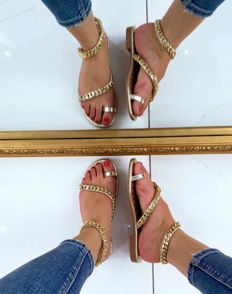 Golden sandals adorned with chains