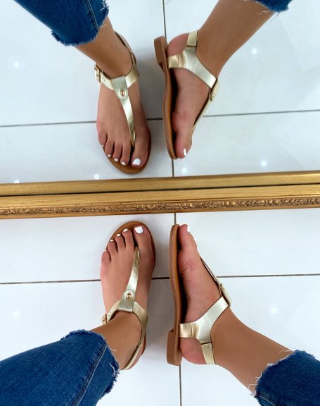 Golden sandals with golden studs
