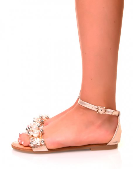 Golden sandals with pearl and shell details