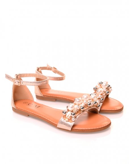 Golden sandals with pearl and shell details