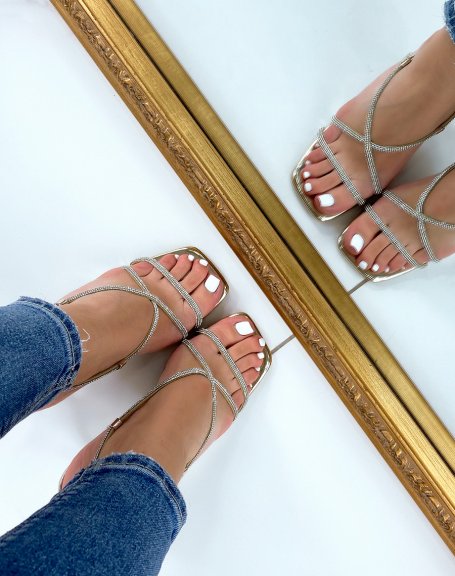 Golden sandals with rhinestones and transparent stiletto heel
