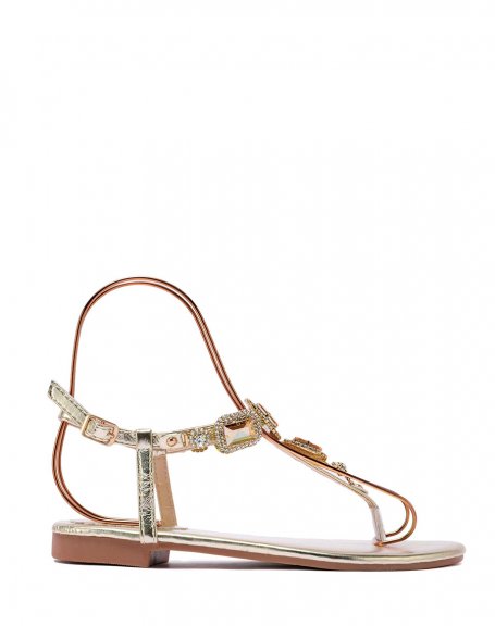Golden sandals with shiny square jewels
